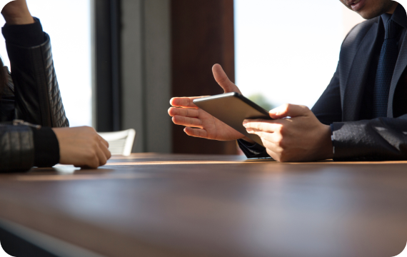 Colleagues discussing a plan across a table