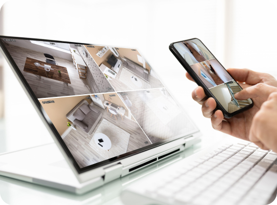 Security camera views displayed on a laptop and phone