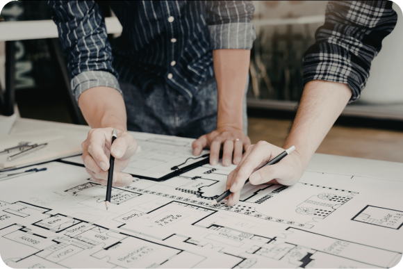 Construction professionals reviewing a floor plan